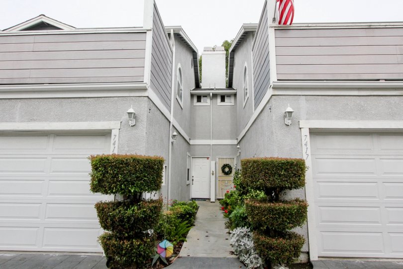 THE 7417 FLAT IN THE WESTERN BAY ESTATES WITH THE PLANTS, SHUTTERS, FLAG