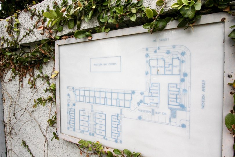 A bright day in the Western Bay Estates with a map on the wall