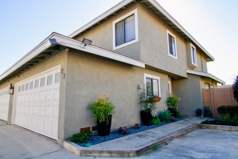 View of two car garage and side entrance to a Hamilton Villas home in Costa Mesa California