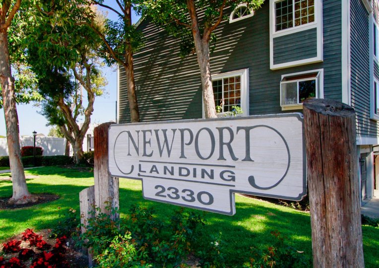 THE BUILDING WITH A FRONT SIGN THAT REPRESENT THE NEWPORT LANDING AND SOME TREES ALSO AVAILABLE.