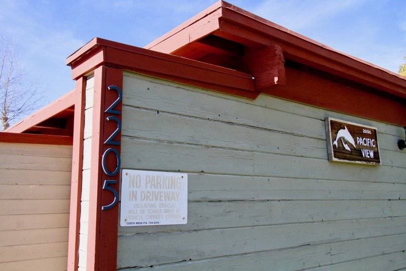 Pacific View Costa Mesa California bulding buliding cover for the compound wall not view for the house wall for the attached three sign board