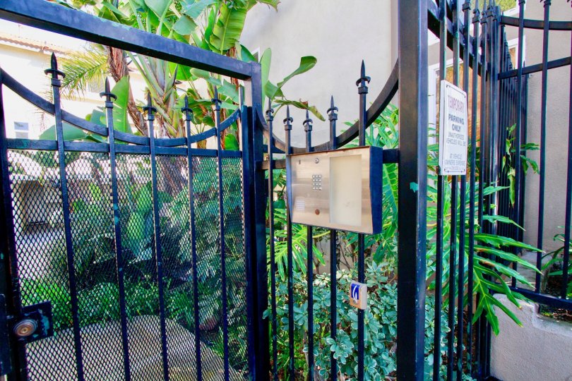 The gated entrance and the intercom to Palermo Townhomes in Costa Mesa, California