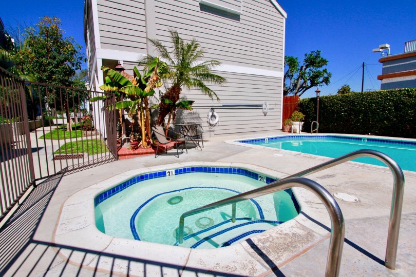 Awesome looking swimming pools with palm trees near villas in Victoria Garden Villas of Costa Mesa