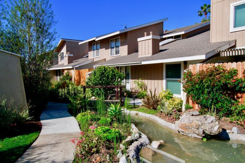 Excellent View of Villa with small stream of pond with trees in Woodstream Condos of Costa Mesa