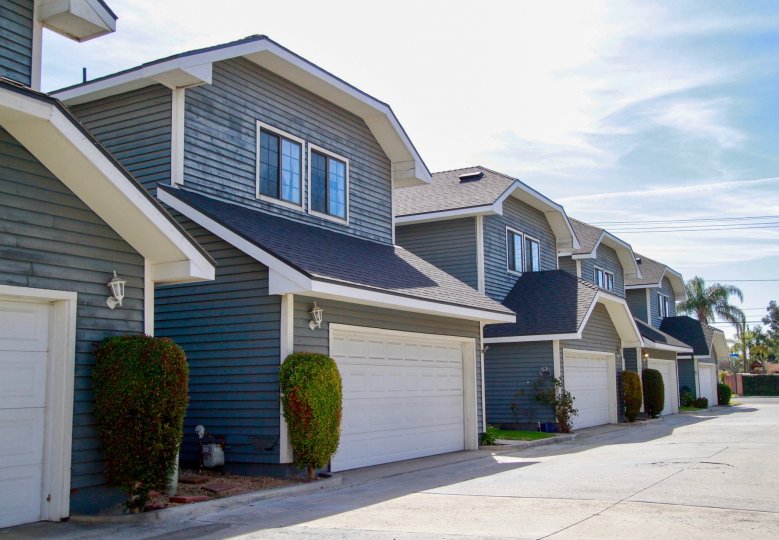 A row of garages fronting units in the Crescent Manor community