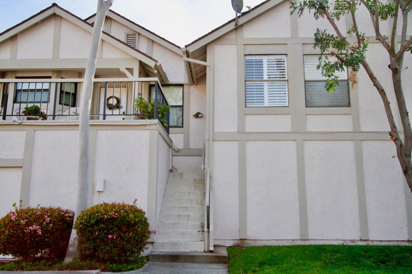 Townhomes with large steps leading to a deck in CA