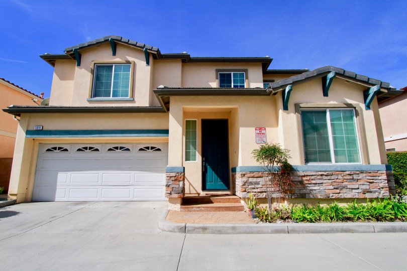 A sunny view of a home in The Cove community located in Cypress, California