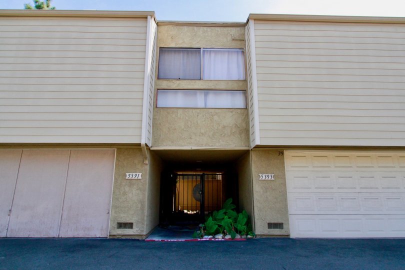A BUILDING WITH TWO FLOOR SHOPS AND THE GROUND FLOOR ENTRANCE ALSO AVAILABLE AND LOOK SANDAL COLOR AT THE MORNING TIME