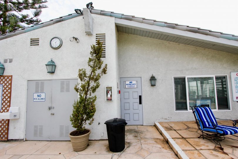 a warm day in the dana bluffs with house that has roof on top and clock, light