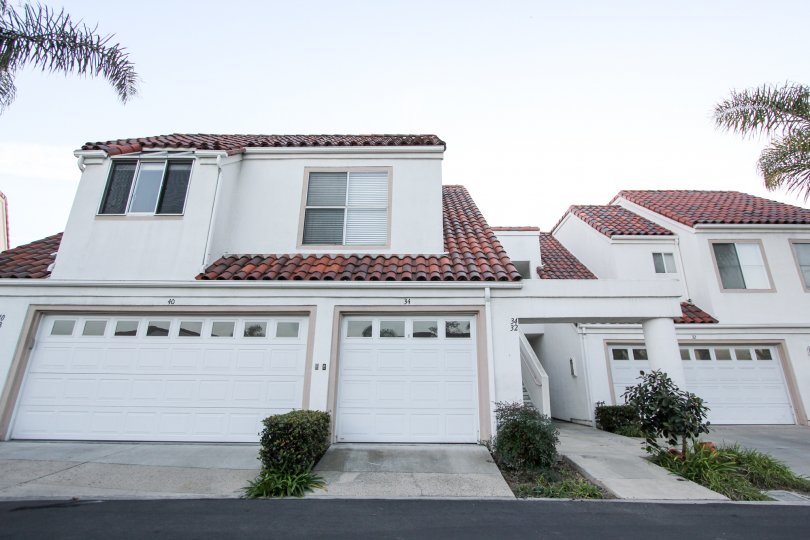 a warm day in the encantamar with house that has door in white and roof in top