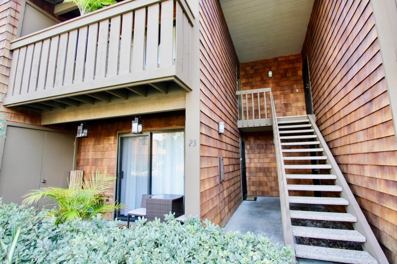 THE 23RD BUILDING IN THE HARBOR CREEK WITH THE UPSTAIRS, PLANTS, TREES, BALCONIS