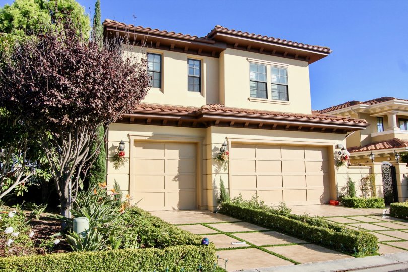 Front open space with driveway and garge doors of Pointe Monarch community, Dana Point, CA