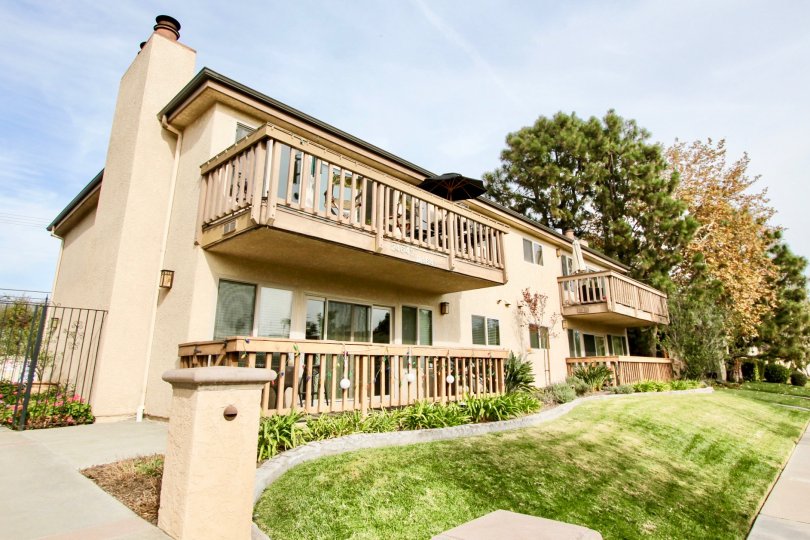 Umbrella is open in one balcony and closed in near balcony of house in Spindrifter condos