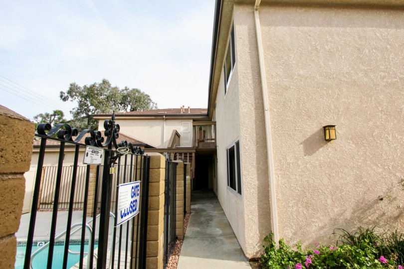 Gate of the Swimming Pool has notice board with some instructions in Spindrifter Condos