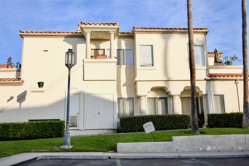 a pleasent day in the tennis villas with house that has roofless top and lamp post