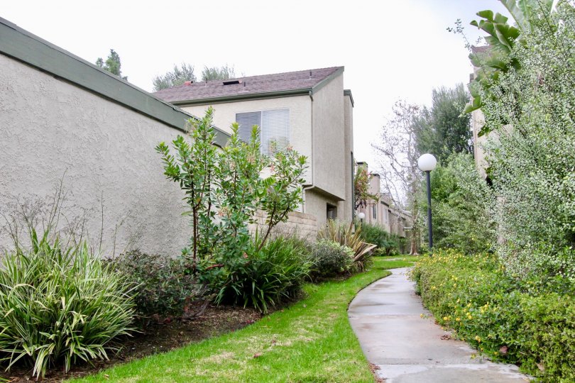 A tall wall lining the edge of residential area in Fountain park community.