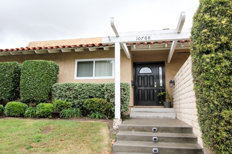Green Valley Townhomes Fountain California with small pillars, lights in steps, green path in side