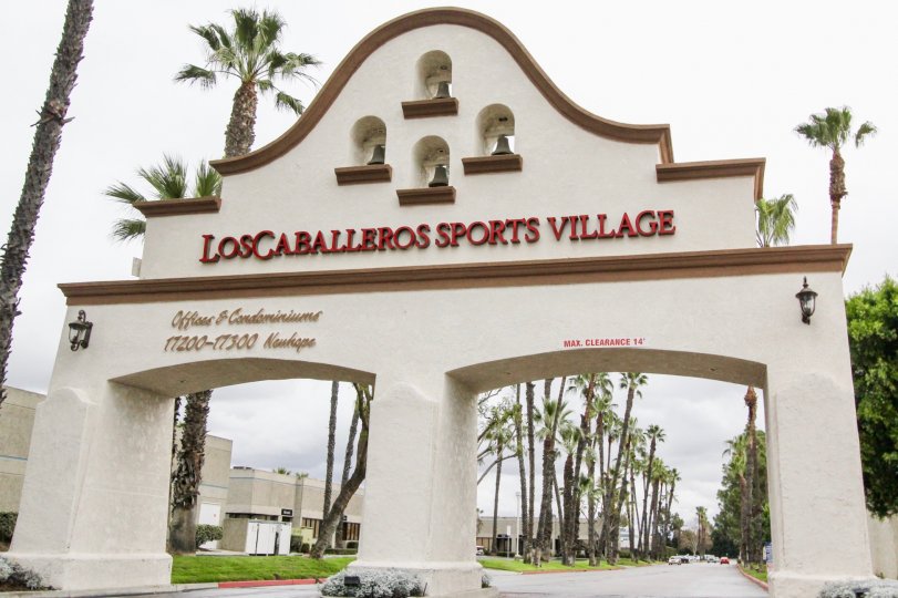 Entrance of Los Caballeros has four bells with light lamps and tallest trees