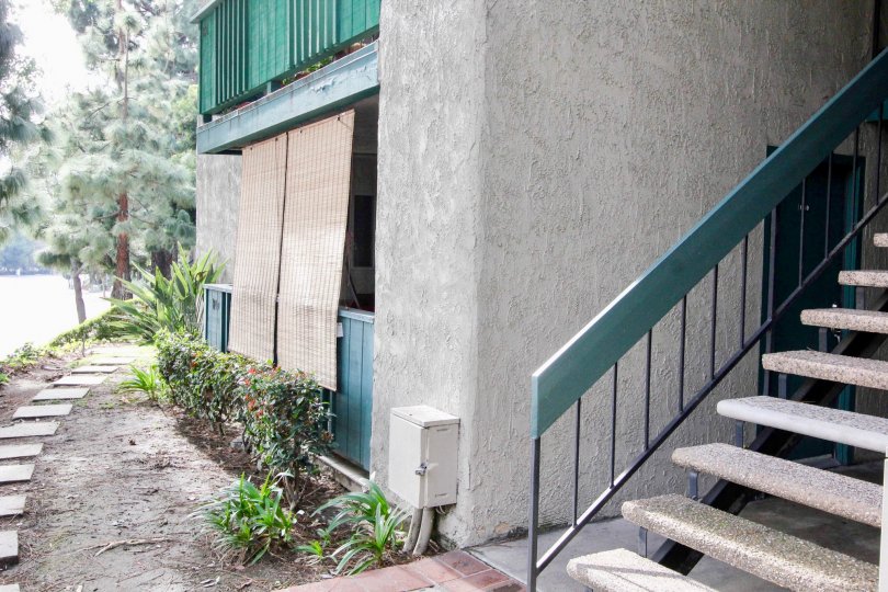 A building in Brea Country with a stair case and a balconies.