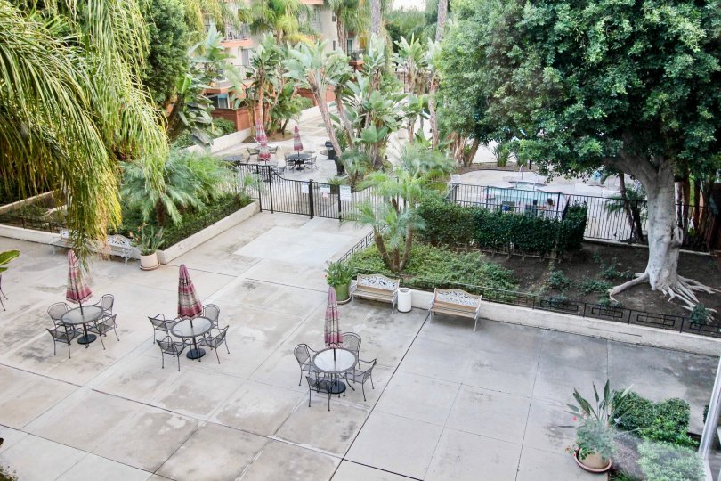 Aerial view of Club Acacia courtyard with chairs and tables.