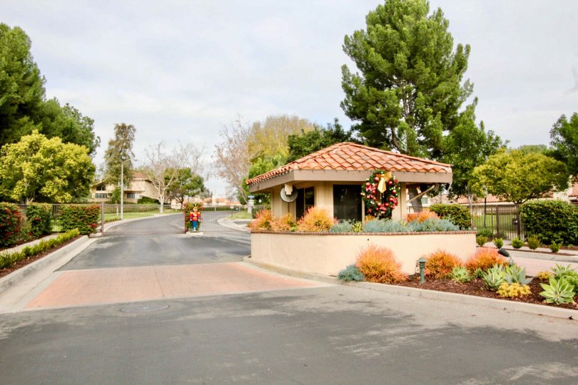 A street in Fairway Village with a small building and a nutcracker.