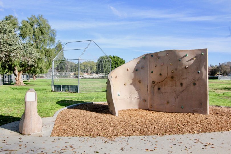 A beautiful day in the Fullerton Fountains with a park and lawn.