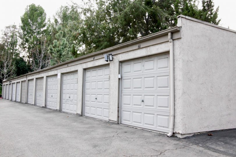 Line of garages with lights for night time located in Park Ridge community.