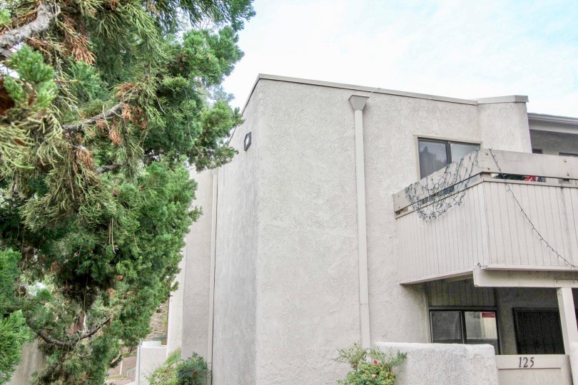 Two story Park Ridge apartment with a balcony and Christmas lights.