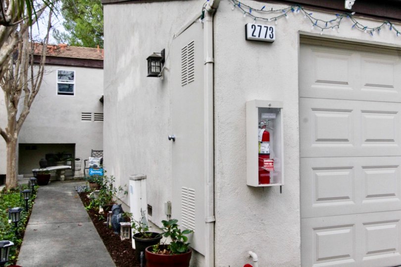 A sidewalk in the Park Vista community with a fire extinguisher and lamps.
