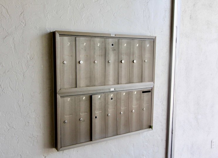Multiple mailboxes in rectangle shape together in Shadow Lane community.
