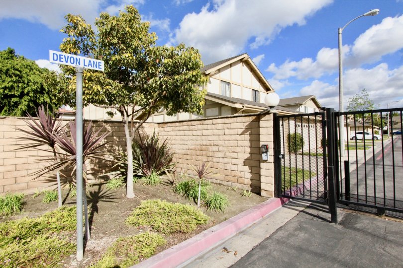 THE HOUSE IN THE DEVONSHIRE VILLAGE WITH THE CAR PARKING, GATE, STREET LIGHT