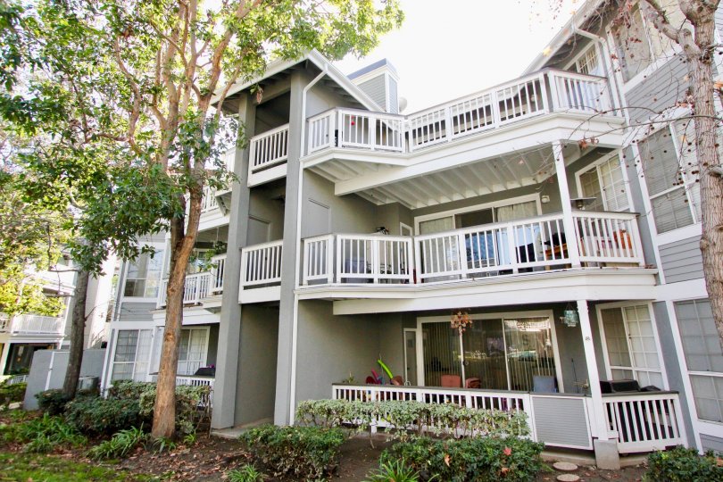 A house with grey colored facade and large balconies inside Greenbrier terraces