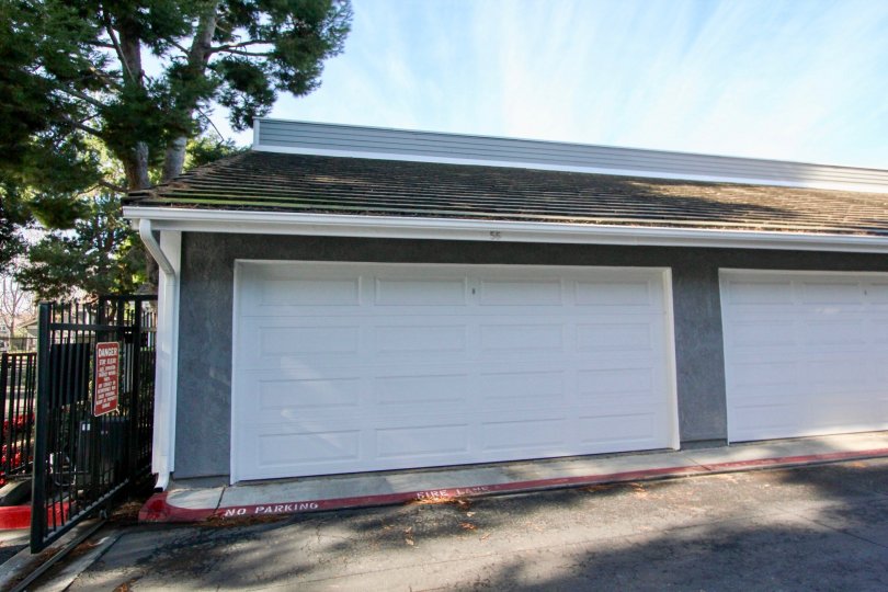 Large Garage Doors in building with No Parking on Curb at Greenbrier Terraces in Garden Grove, CA