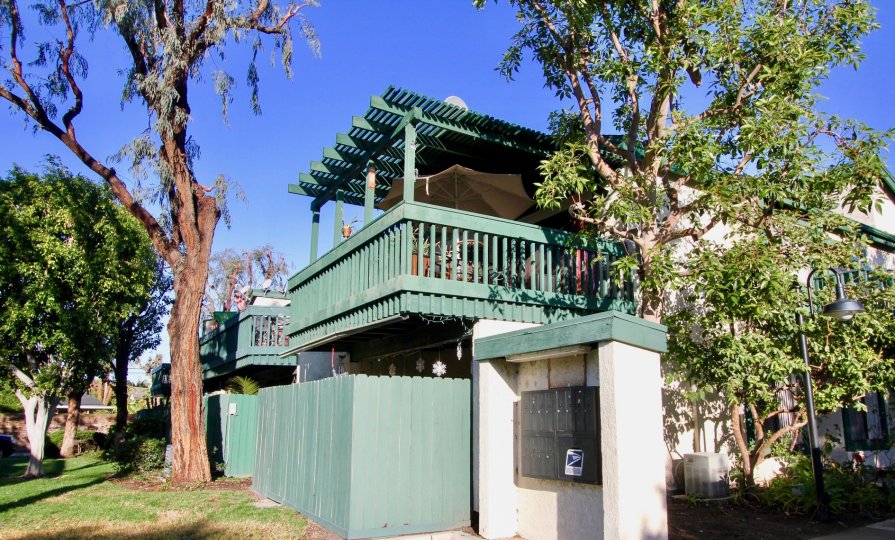 The Greenhouse West in the Garden Grove with Houses and trees