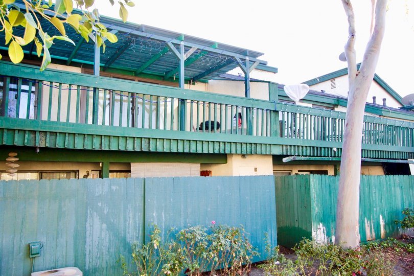 wood compound wall around buildings in Greenhouse West