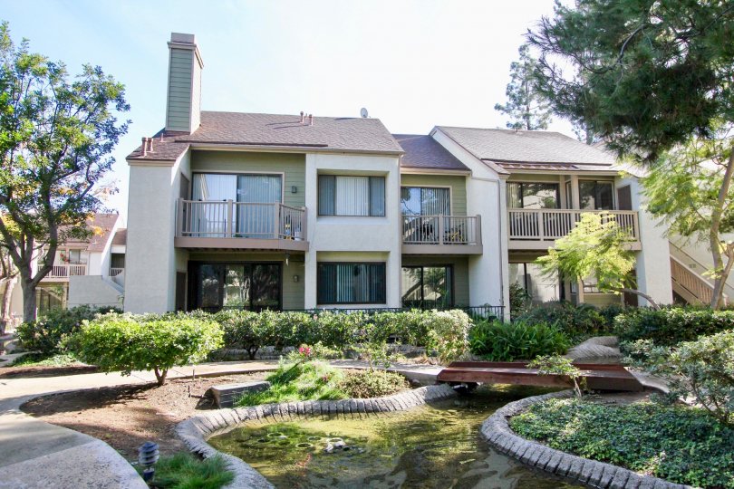 THE HOME IN THE LAKESIDE WITH THE PATHWAY, PLANTS, TREES