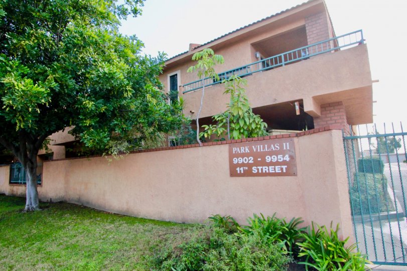 THE 9902 - 9954 APARTMENTS WITH THE PLANTS, LAWN, TREES IN THE 11TH STREET, PARK VILLAS II