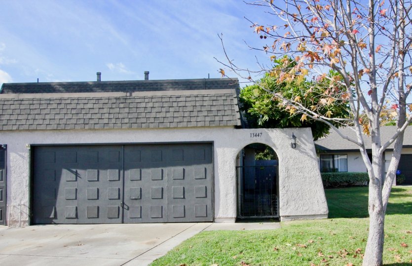A house with massive entrance with car parking and granden at Willow Trail Garden Groe California