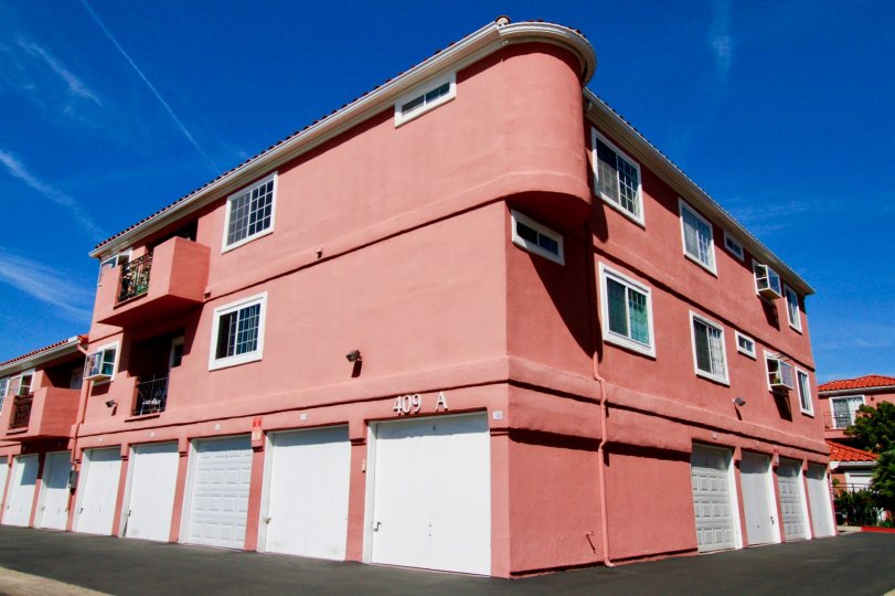 THE BUILDING AT THE CENTRE OF THE PLACE AND IT LOOKS LIKE RED COLOUR AT THE MORNING TIME