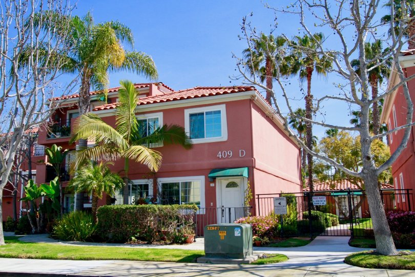 Brisas Del Mar Huntington Beach California house red color paint only window attach near to tree