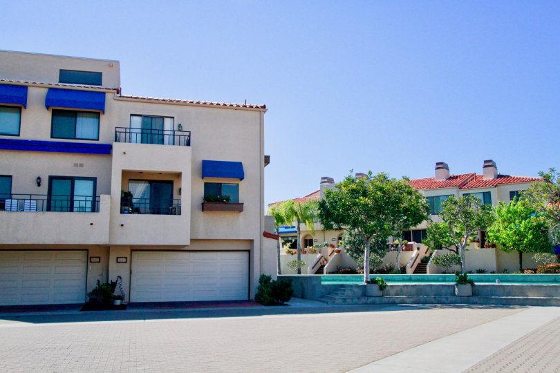 A cement front yard in the residential area of Broadmoor Huntington harbor.