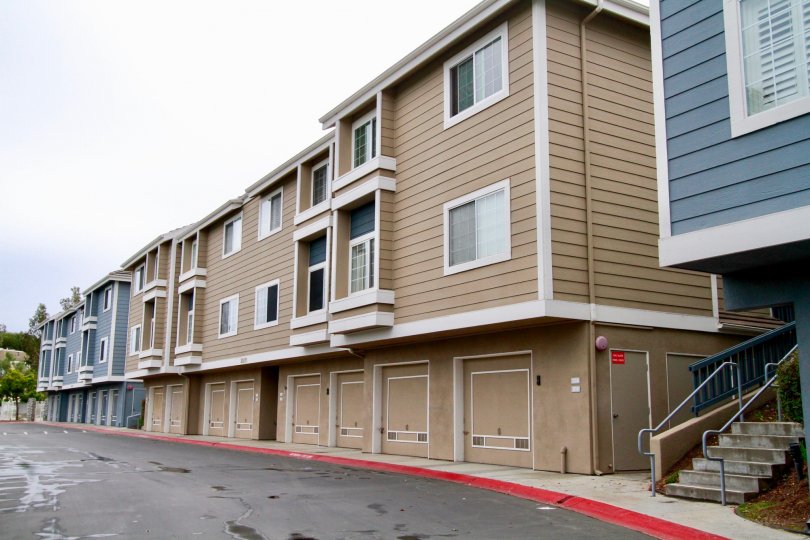 Seabridge Townhomes Huntington Beach California building is biscuts color and blue paint apply glass window attached steps attached