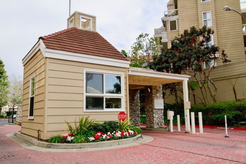Seabridge Villas security building with a stop sign on a cloudy day.