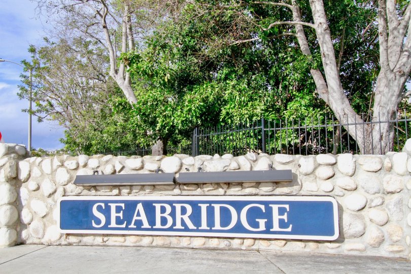 THE SEABRIDGE VILLAS THE SIGN BOARD IS DESIGN FOR ROCKS IS NICE IN HUNTINGTON BEACH IN CA