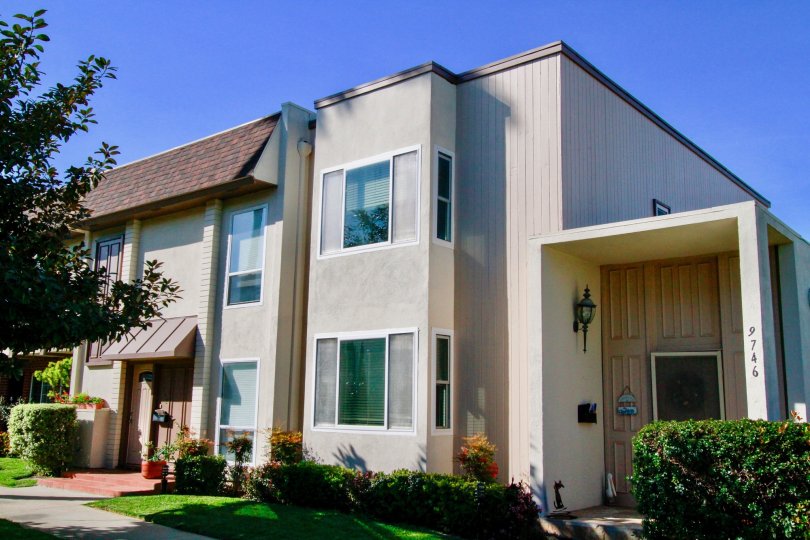 the own house with huge door in front of it in villa pacifica of huntington beach california