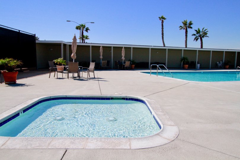Weatherly Bay Huntington Beach California building brown paint two swmming pool bench water attached