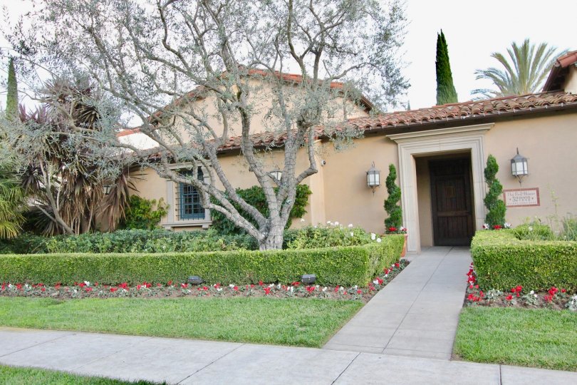 A street view of a home and landscaped yard on a sunny day at Chantory