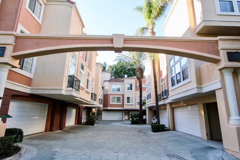 Come home to a palm tree lined path and your own private garage at Corte Bella Villas