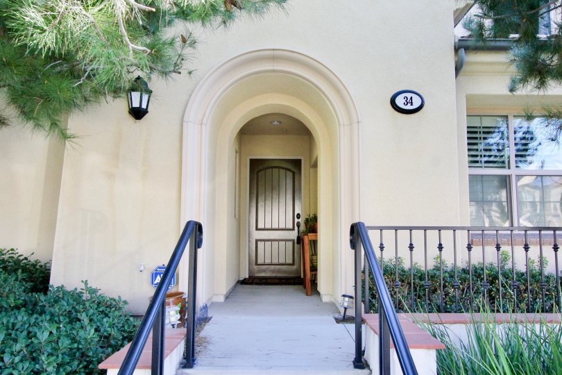 A house with massive entrance with many balcony and garden in Four Quartets irvine, California