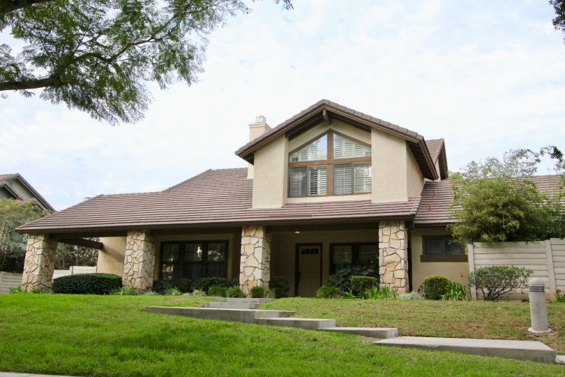Quaint Brown and Stone House in Suburbs in Irvine California. Large front and backyard, and front patio.